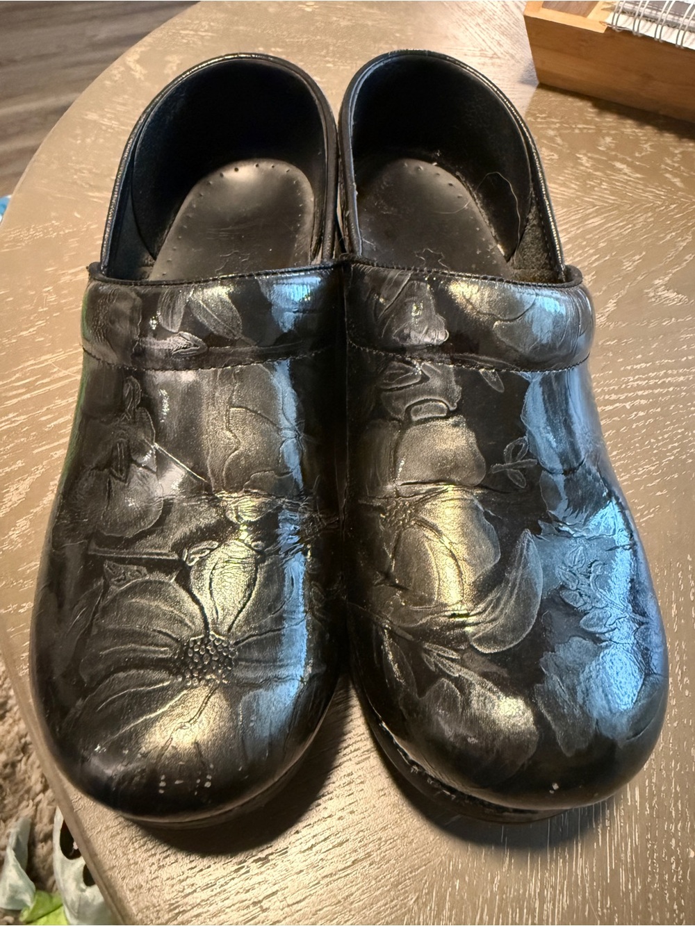 Dansko Black Floral Embossed Leather Clogs